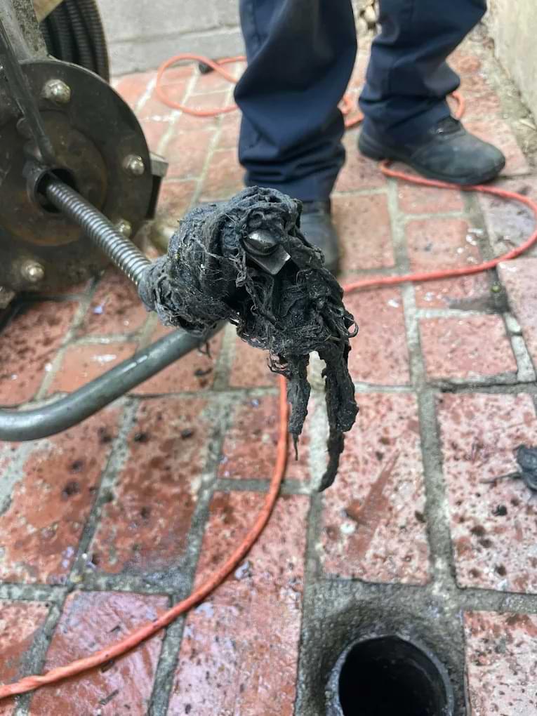 Plumber is clearing drain in los angeles home with our affordable Drain Cleaning Los Angeles