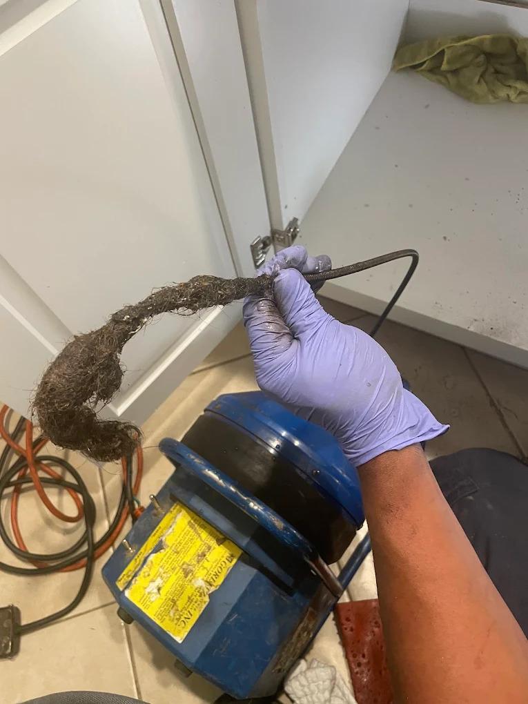 Drain Cleaning LA John's Plumbing & Drain Services Plumber is providing drain cleaning services in los angeles. Our plumber found hair in the drain which causes clog.