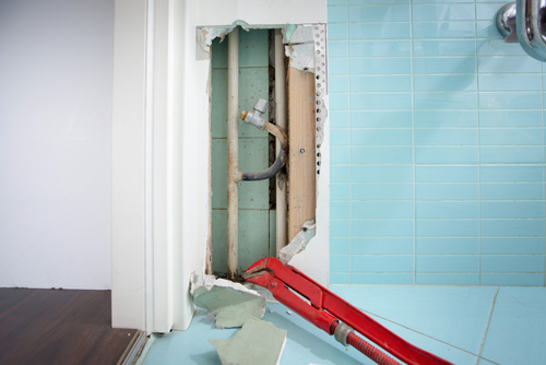 What to Do When a Pipe Is Leaking Behind Your Wall